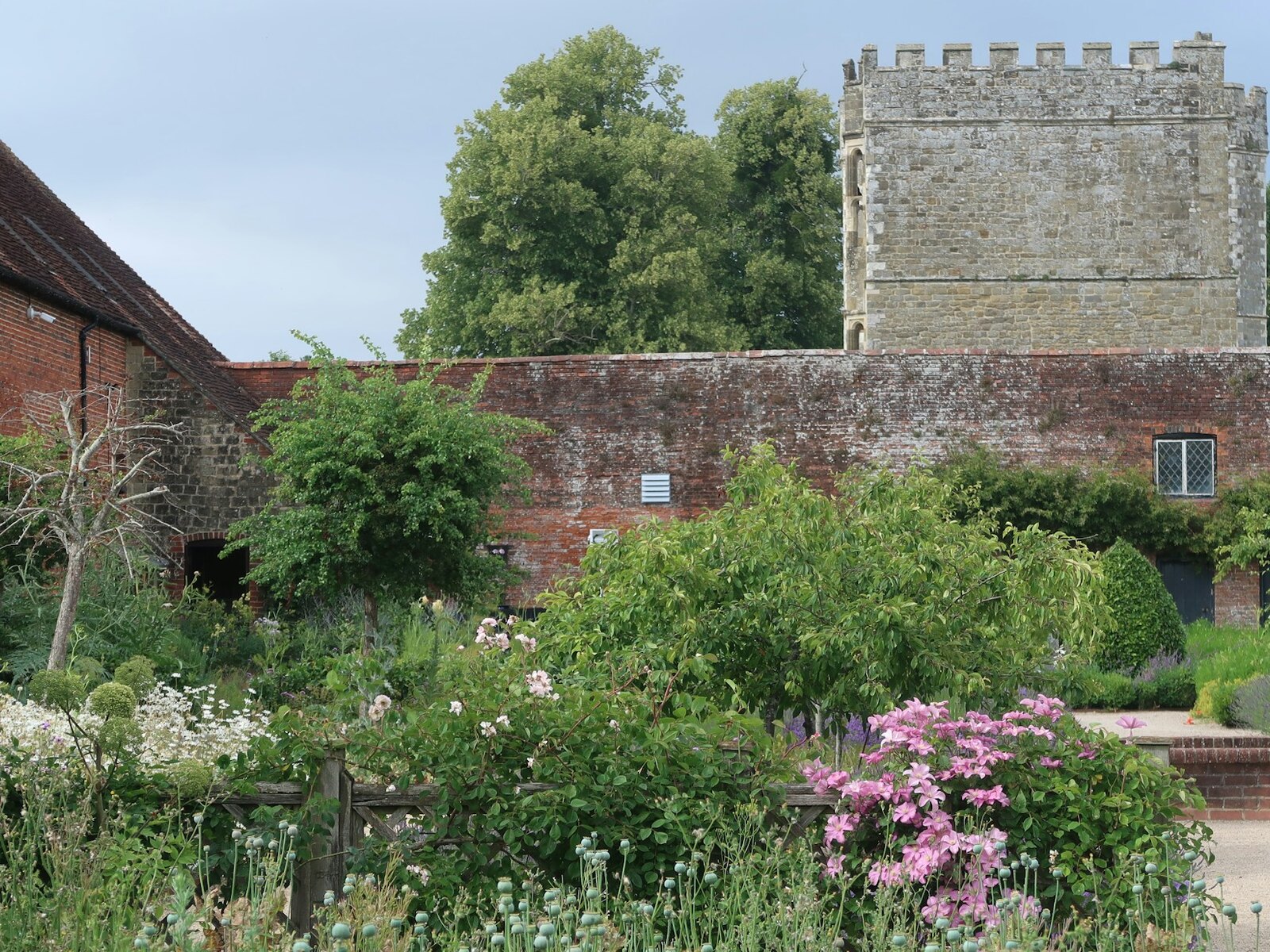 A green walled garden set for an outdoor ceremony